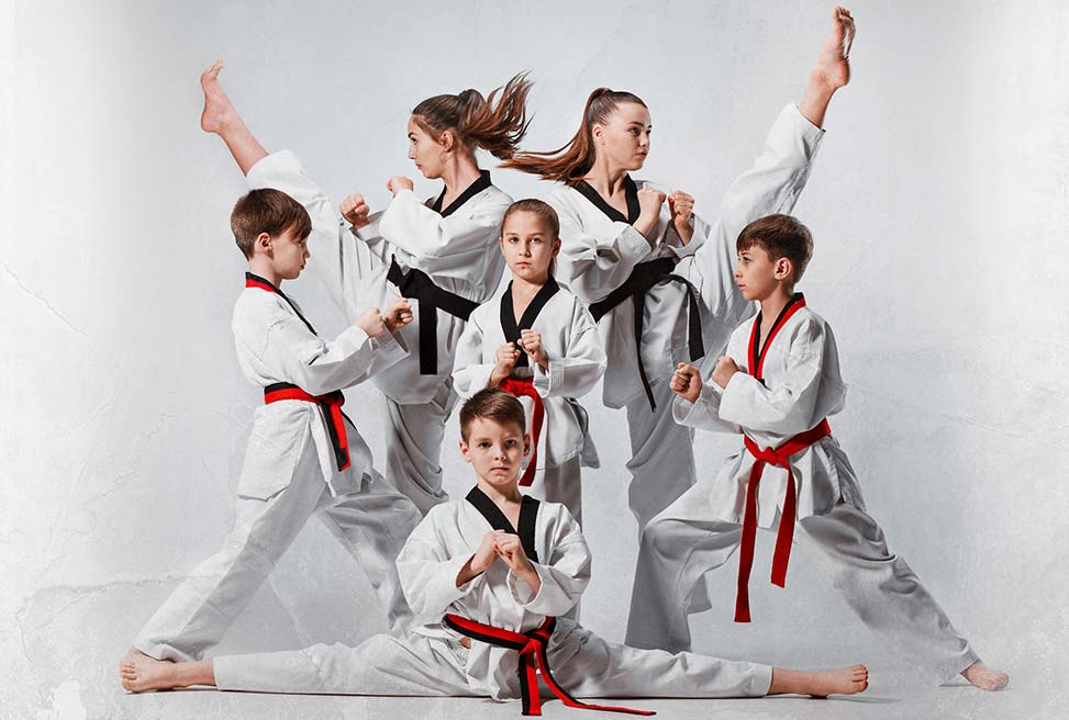 A group of young people are practicing karate together.