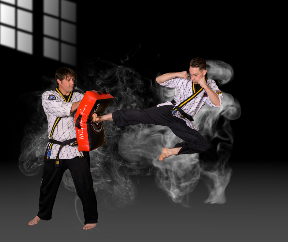 Two men are practicing martial arts in a dark room.