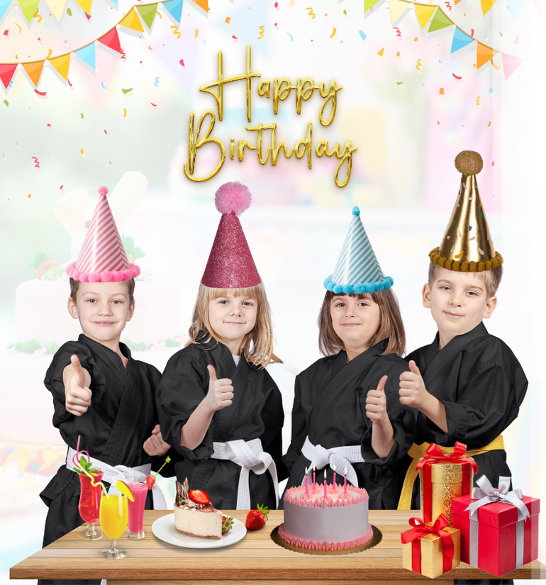 A group of children wearing party hats are standing around a table with a cake and gifts.
