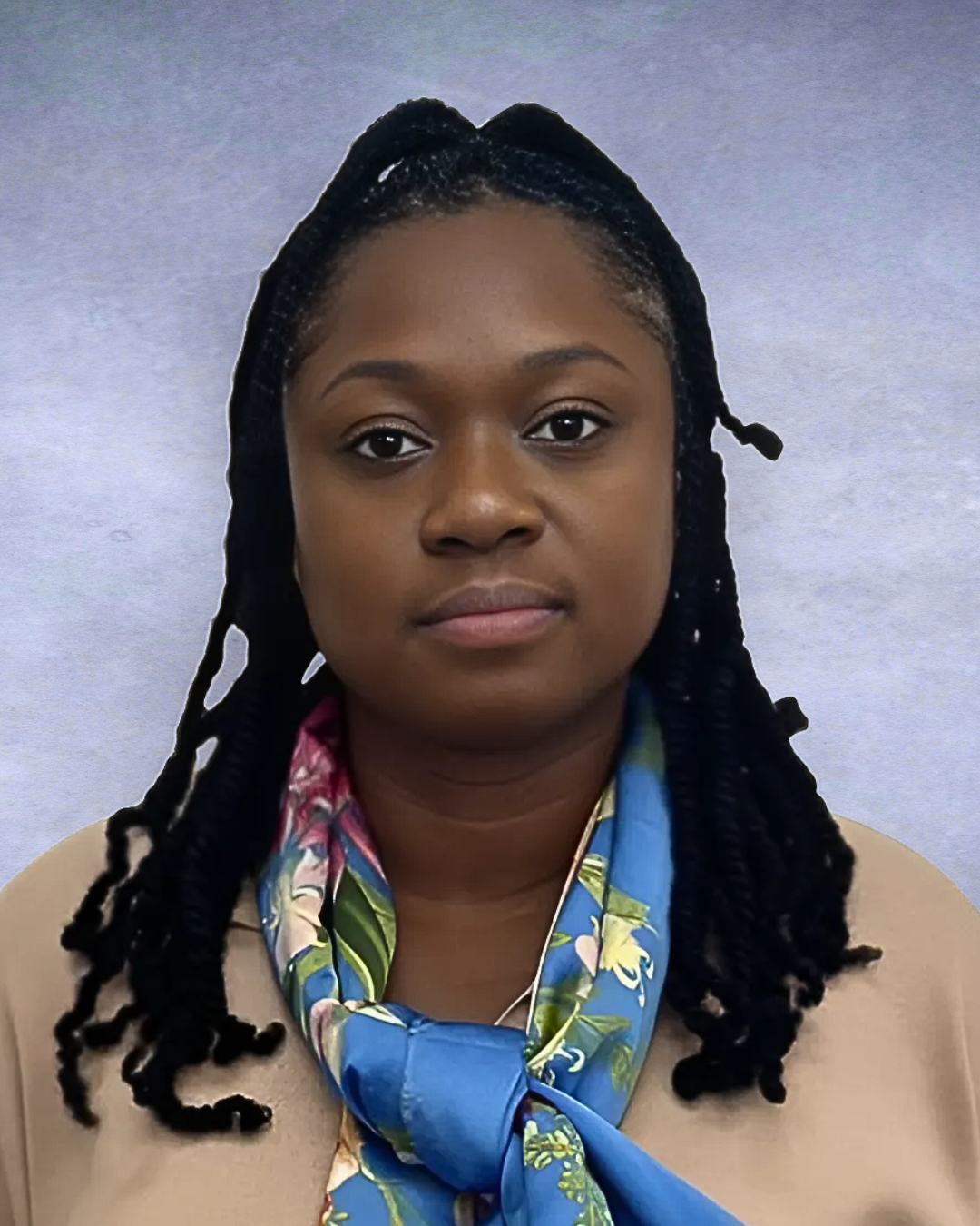 Portrait of a woman with braided hair, wearing a beige top and blue patterned scarf against a gray background