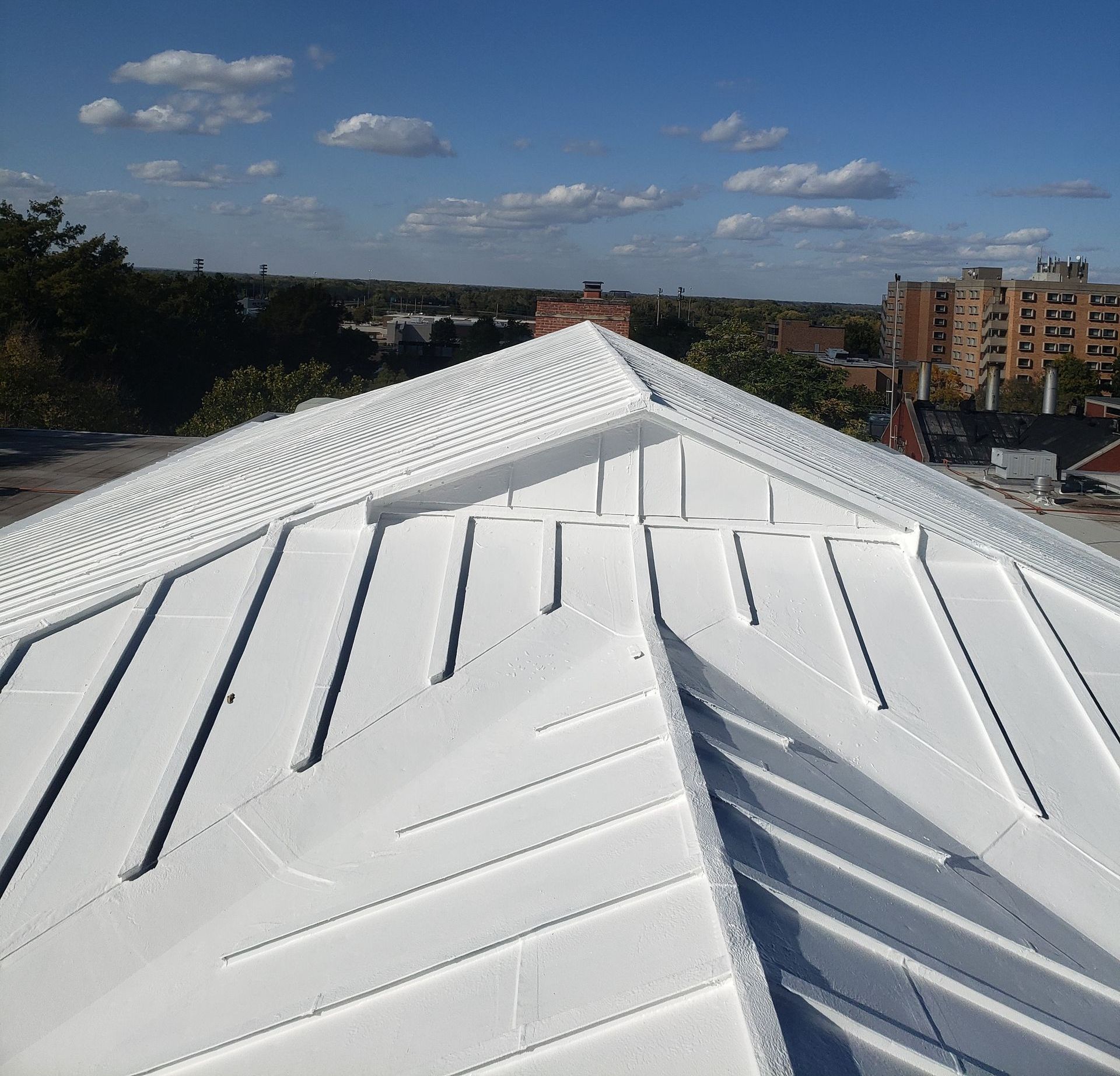 A white roof with a blue sky in the background
