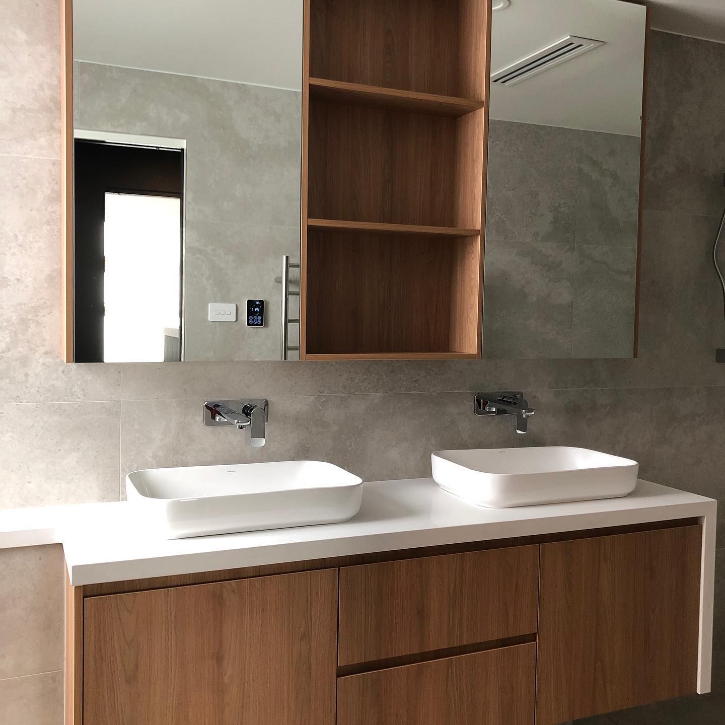 A Bathroom with Two Sinks and A Mirror — Inovative Interiors In Cardiff, NSW