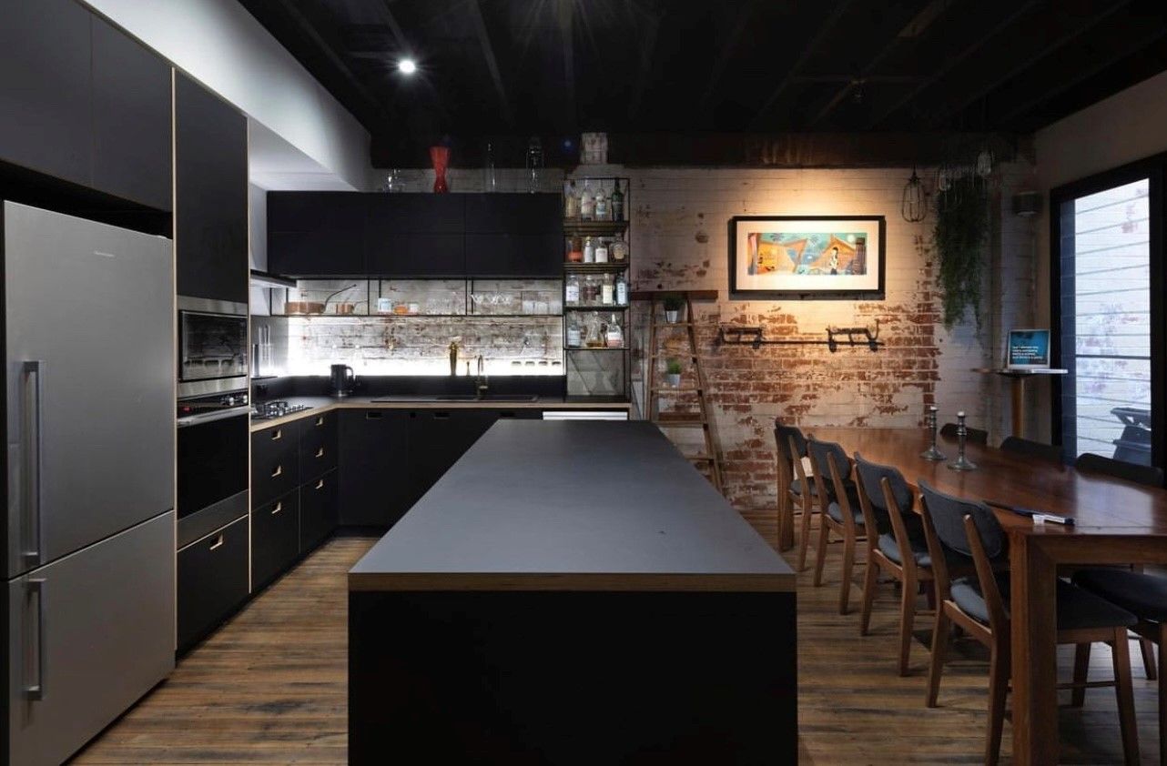 A Kitchen with Brown Cabinets — Inovative Interiors In Cardiff, NSW