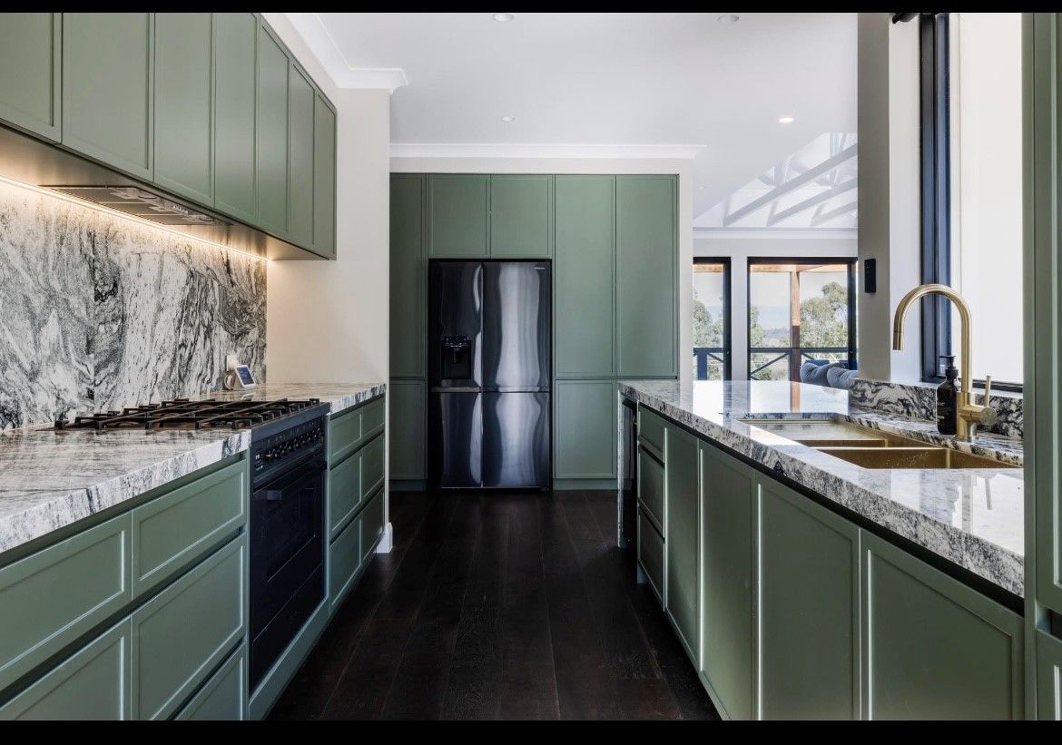 A Kitchen with White Cabinets — Inovative Interiors In Cardiff, NSW