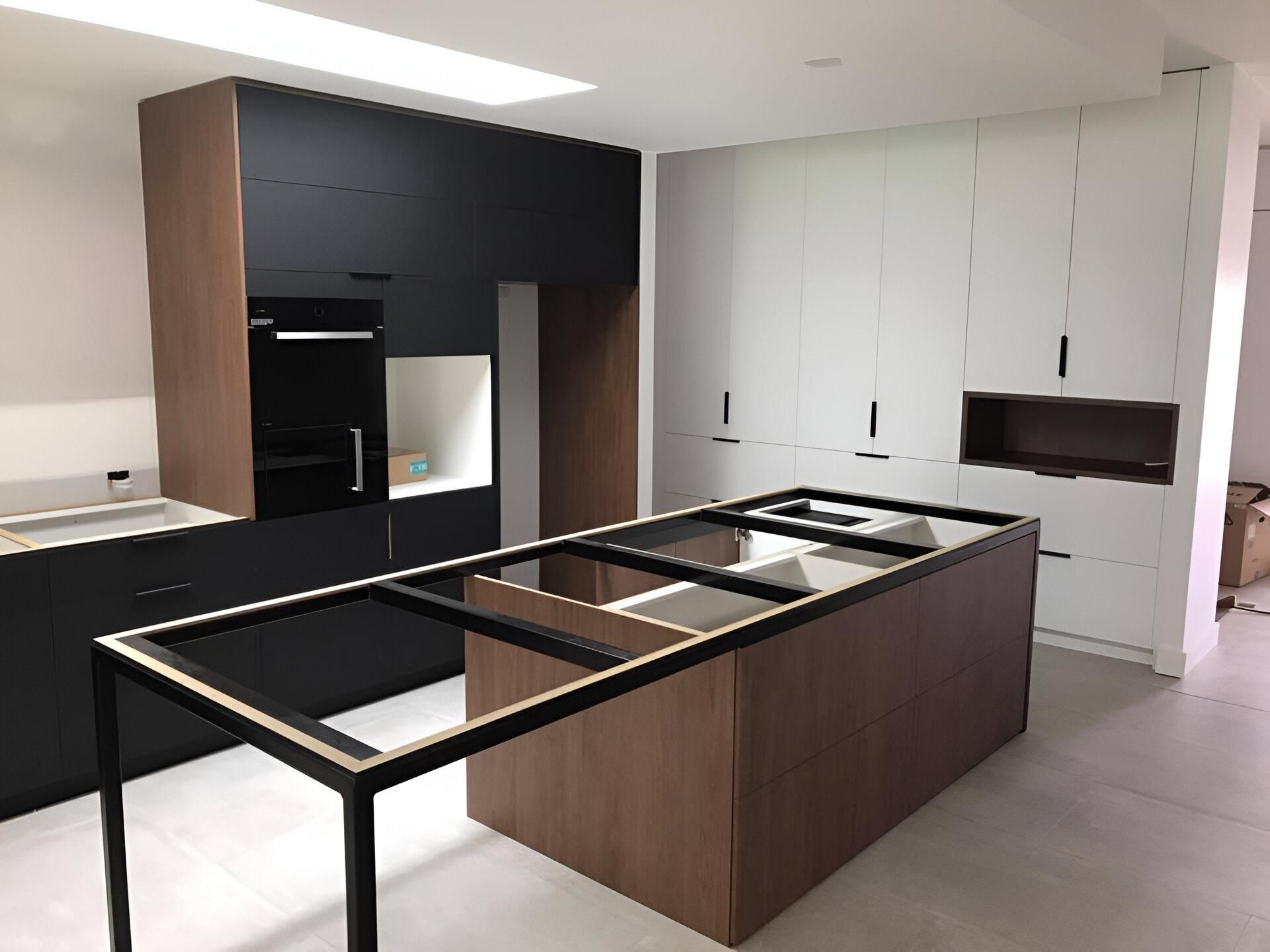 A Kitchen with A Large Island in The Middle of It — Inovative Interiors In Cardiff, NSW