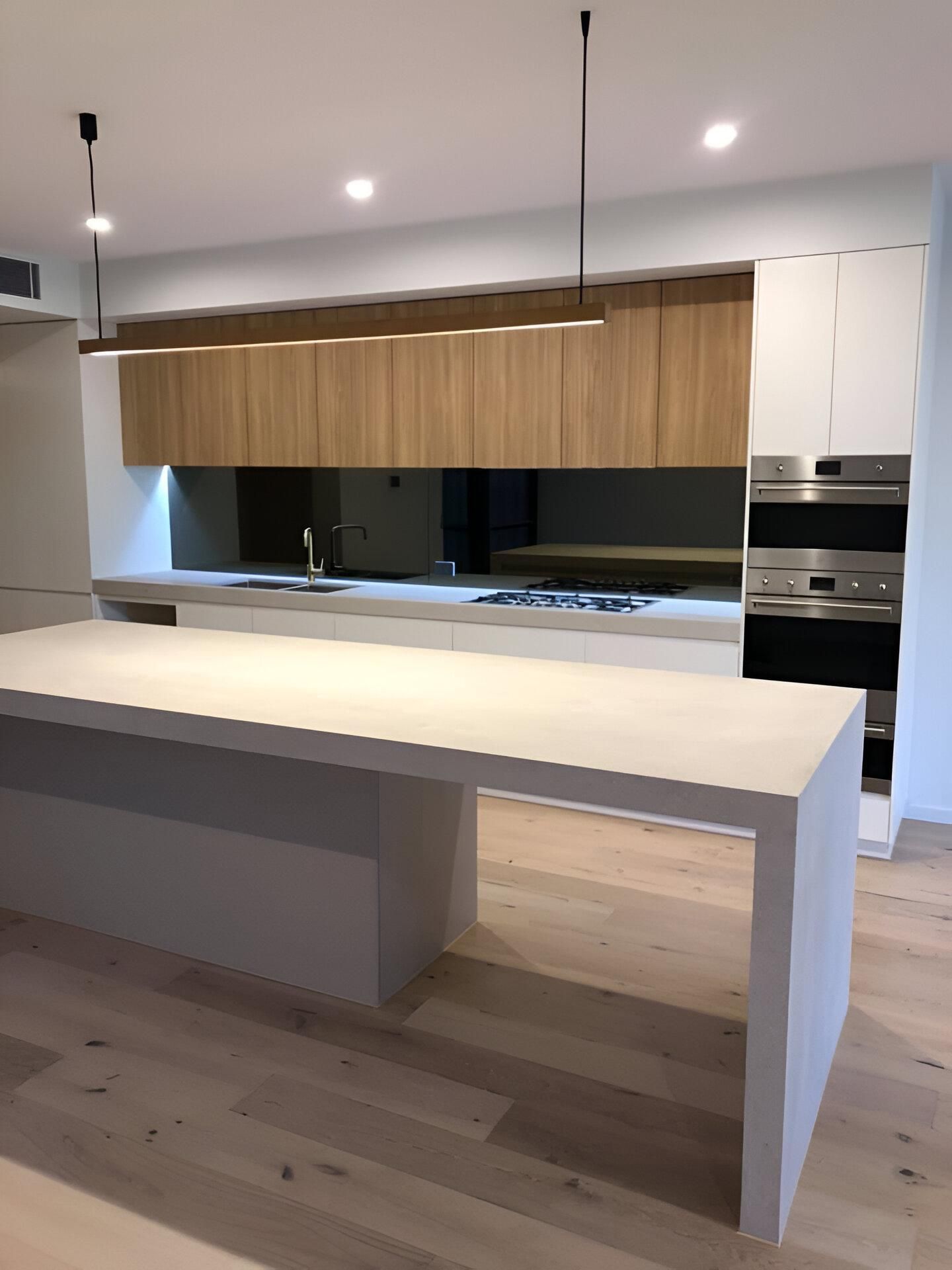 A Kitchen with A Large Island in The Middle of It — Inovative Interiors In Lake Macquarie, NSW