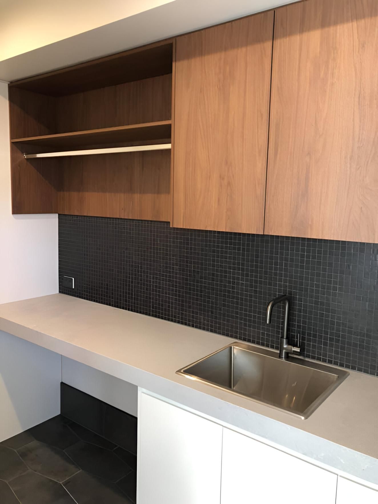 A Kitchen with A Sink and Wooden Cabinets — Inovative Interiors In Lake Macquarie, NSW