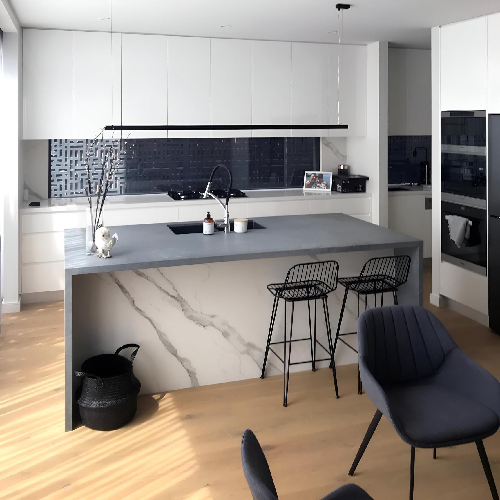 A Kitchen with A Large Island and Stools — Inovative Interiors In Maitland, NSW