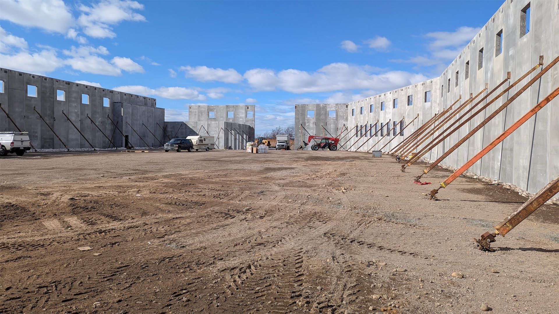 The new 56,000 SF commercial bakery under construction with precast concrete wall panels or structural framing visible. Toufayan Bakeries - Ridgefield, NJ