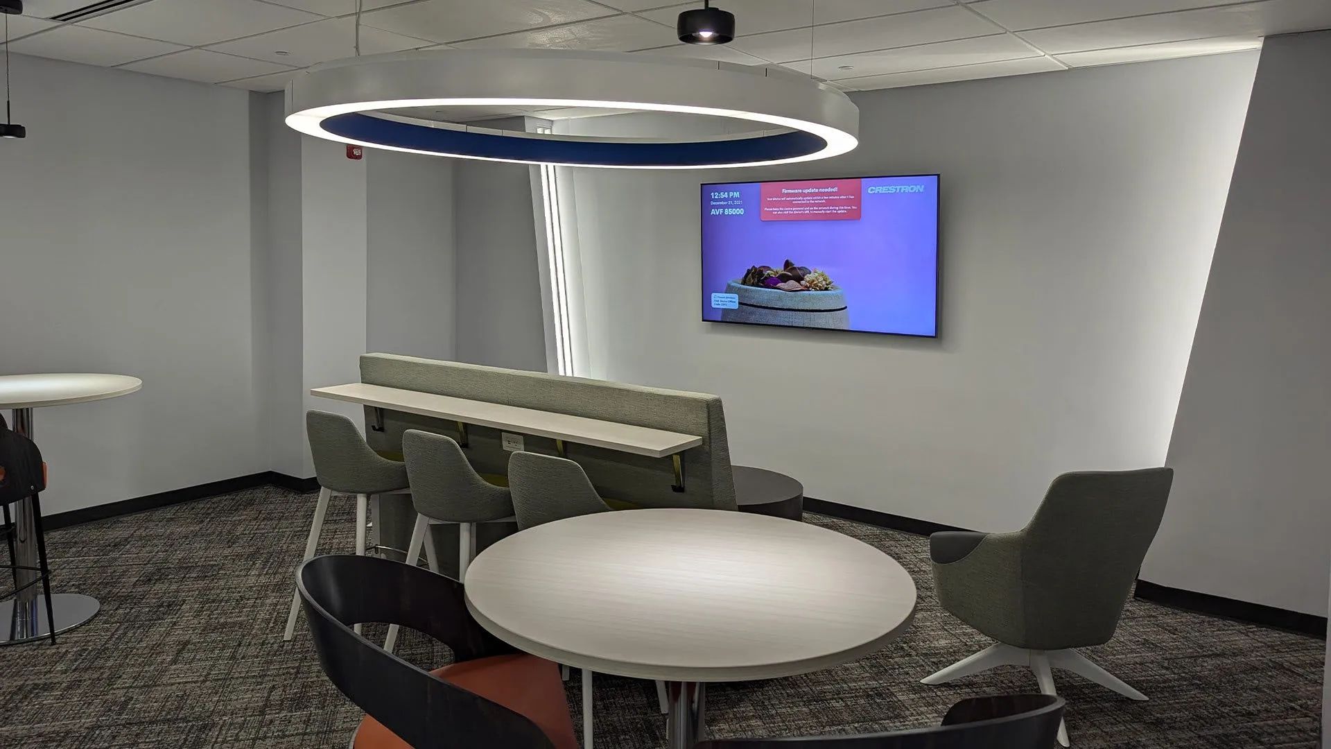 Bluecrest Legal reception counter with coffee station, gray cabinetry, and branded floor mat