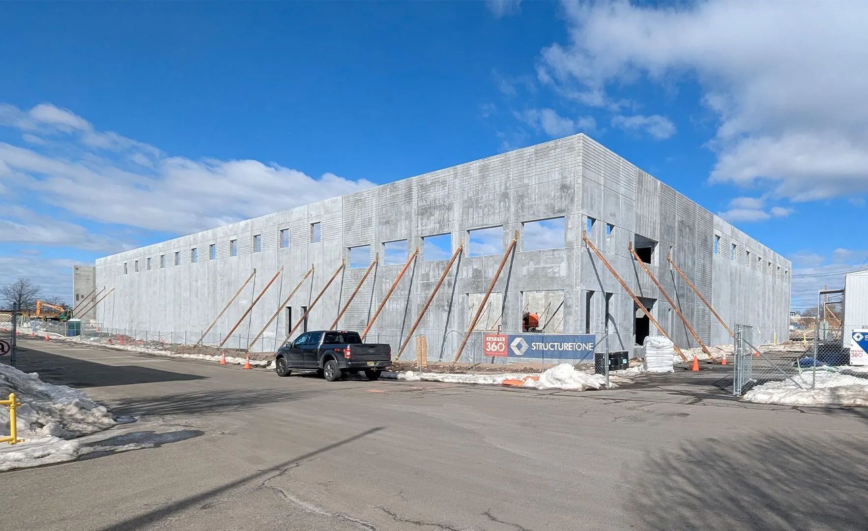 The new 56,000 SF commercial bakery under construction with precast concrete wall panels or structural framing visible. Toufayan Bakeries - Ridgefield, NJ