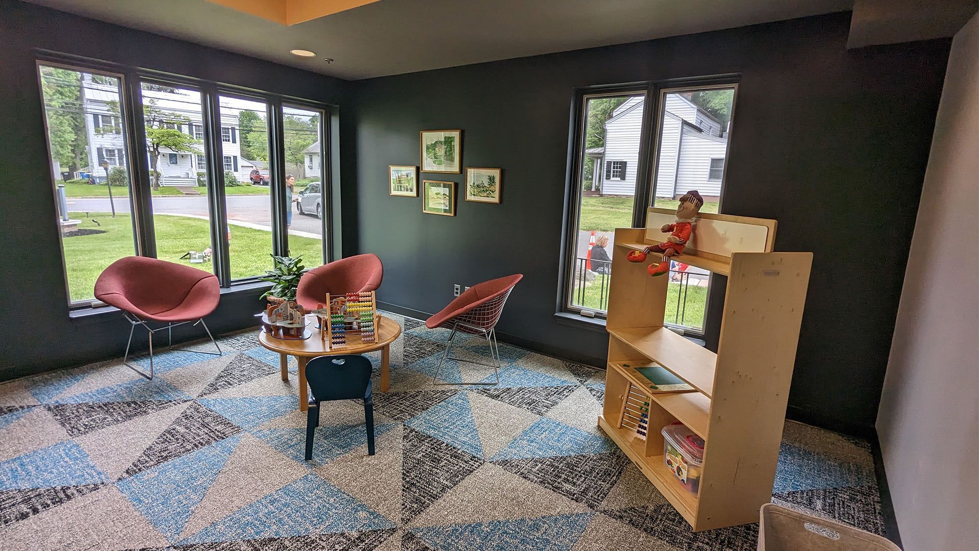 Rocky Hill Library — Rocky Hill, NJ - The children's room or main reading area showing the bright, renovated interior with rich colors, flexible furniture, and the modernized space.