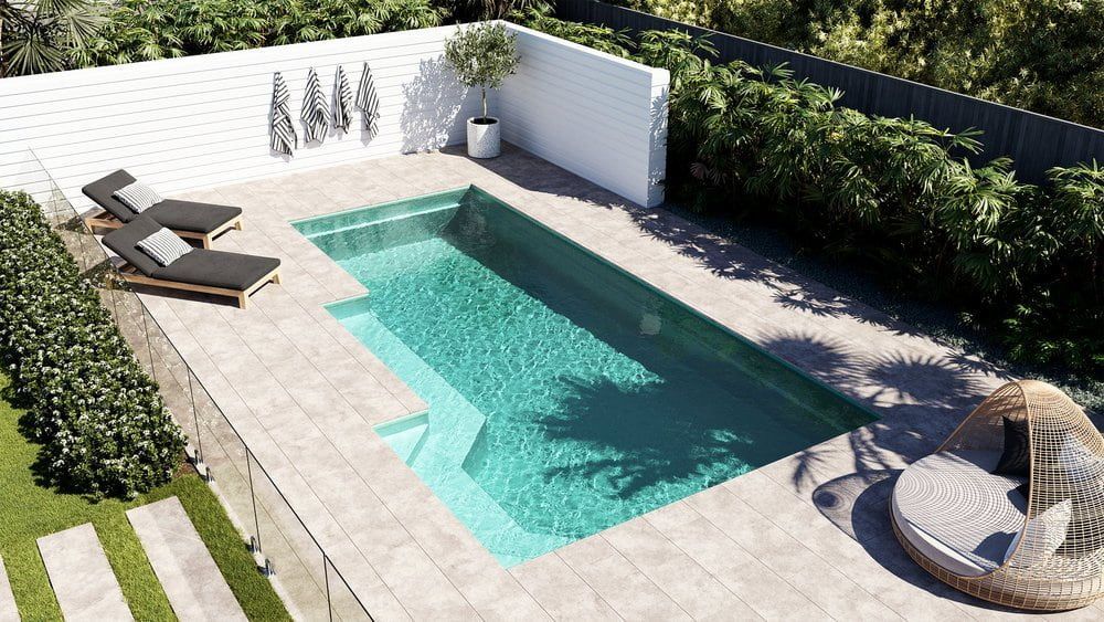 An Aerial View Of A Large Swimming Pool In A Backyard — Solitary Island Pools in Coffs Harbour, NSW