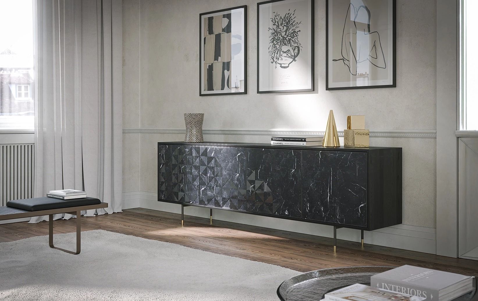 Soggiorno moderno con credenza nera, quadri incorniciati, arredamento neutro e tavolino rotondo accanto a una finestra.
