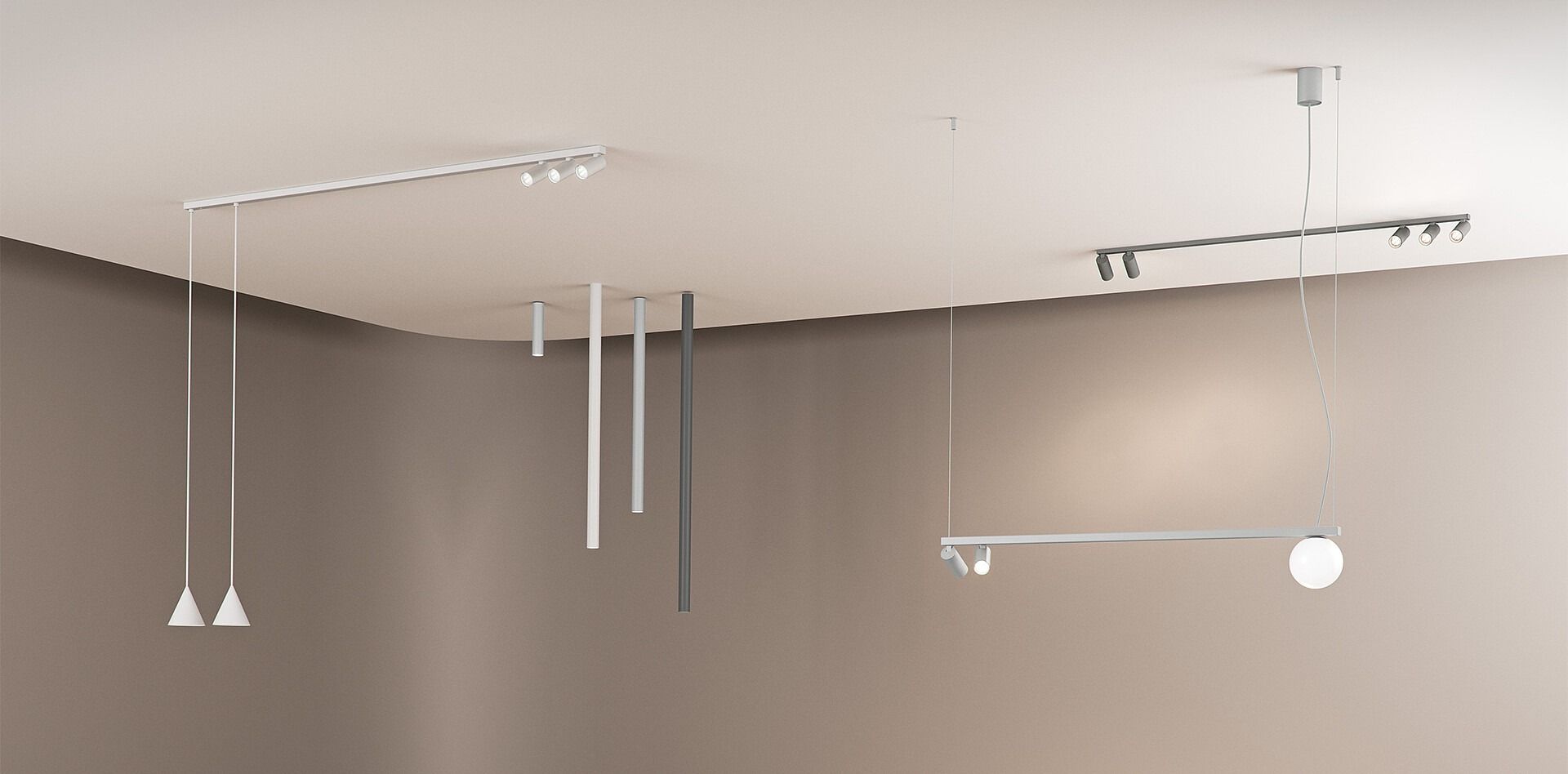 Stanza minimalista con diverse lampade a sospensione e faretti a binario montati a soffitto.