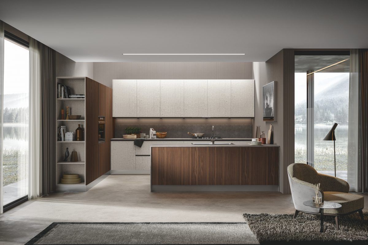 Cucina moderna a pianta aperta con mobili in legno, ripiani bianchi e finestre a tutta altezza con vista sulle montagne.