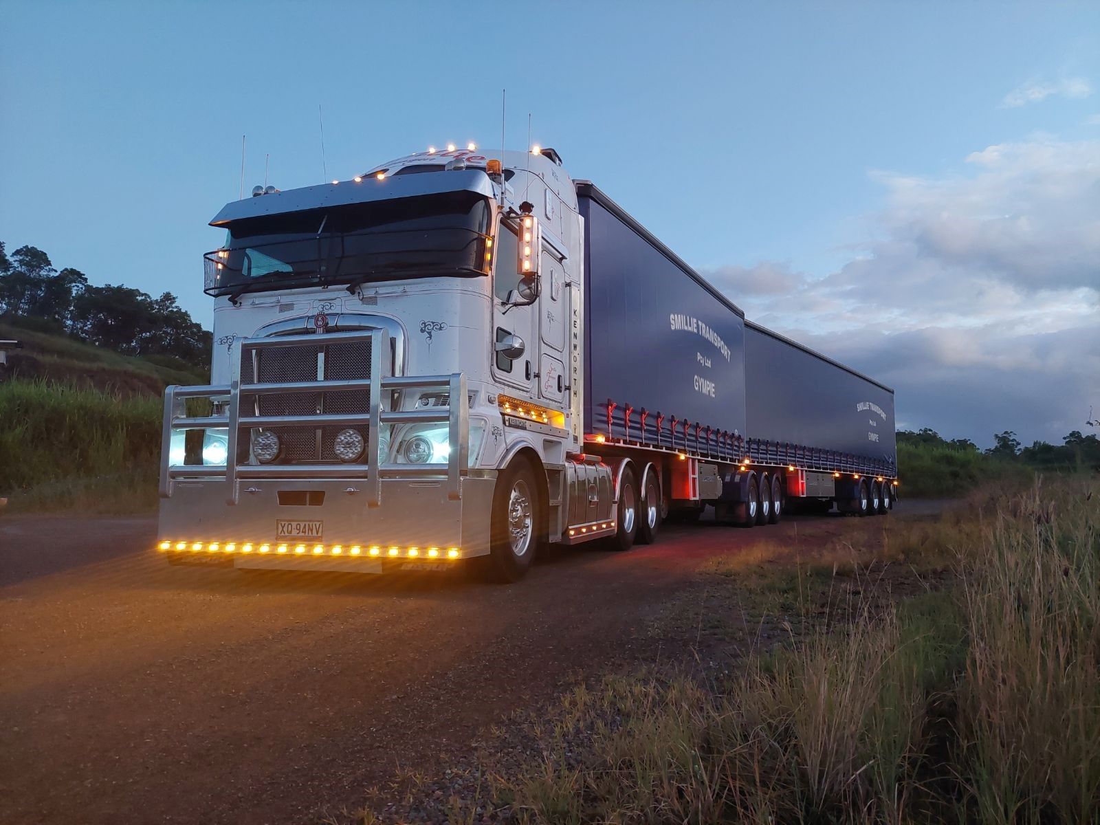 A Row of Trucks Parked Next to Each Other in A Parking Lot — Smillie Transport Pty Ltd in Brisbane, QLD
