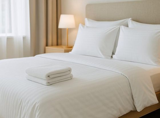 letto con corredo bianco