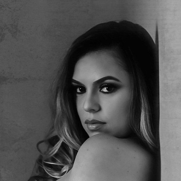 A black-and-white photo Dr Kaly Castellanos.