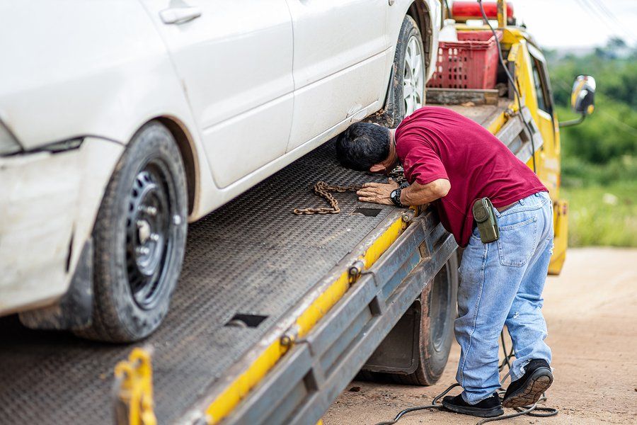 man towing a car