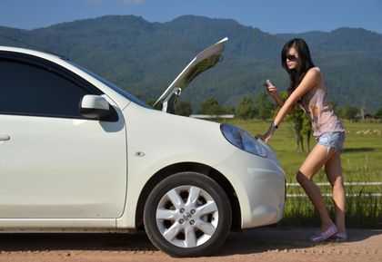 woman calling for towing service