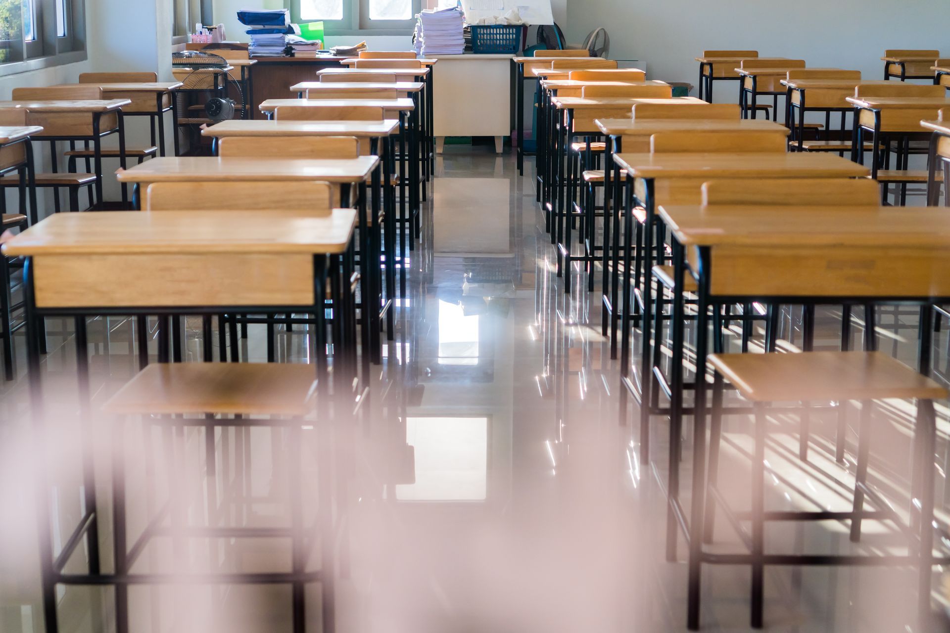 Kids' classroom with students raising their hand