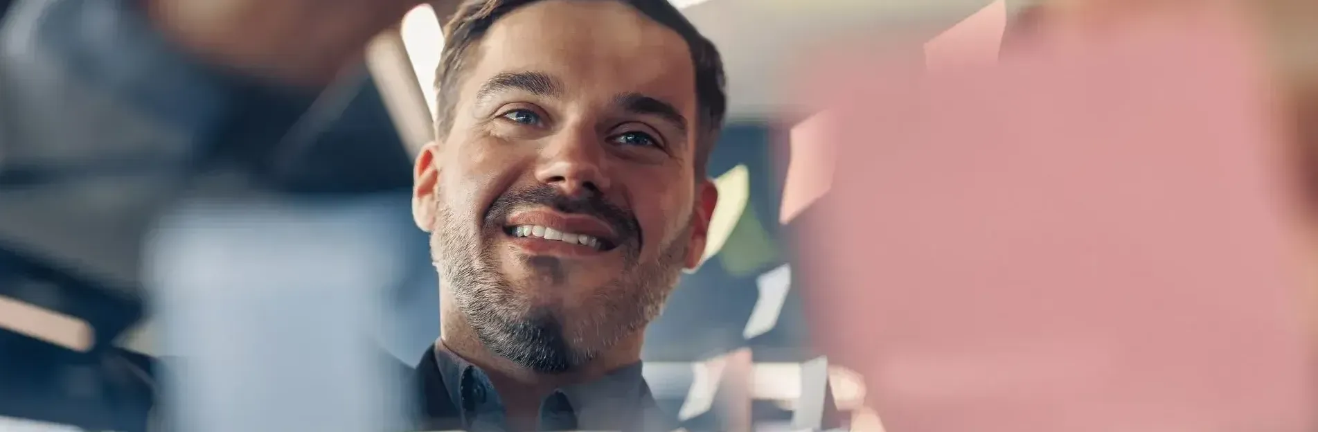 Man smiling as he understands the data recruitment process