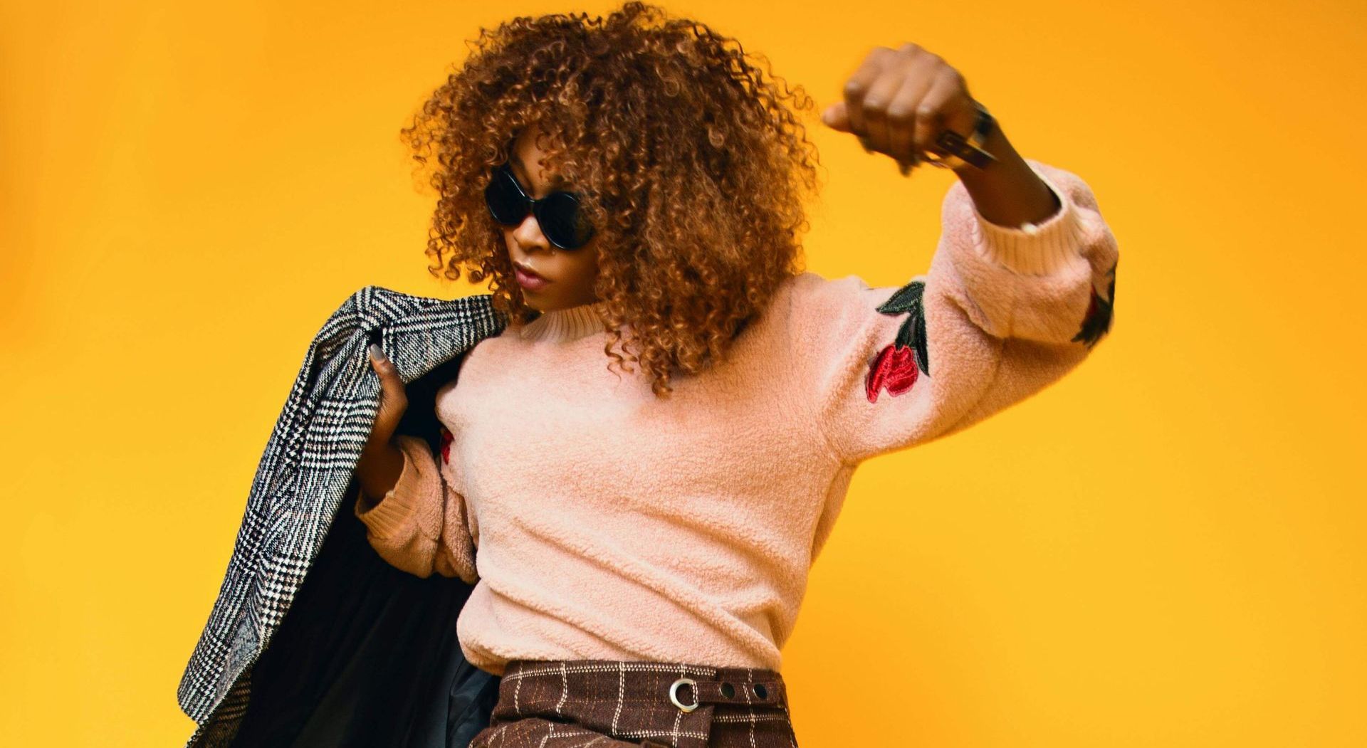 A woman cheering that she is ahead in her career by keeping on top the trends in data