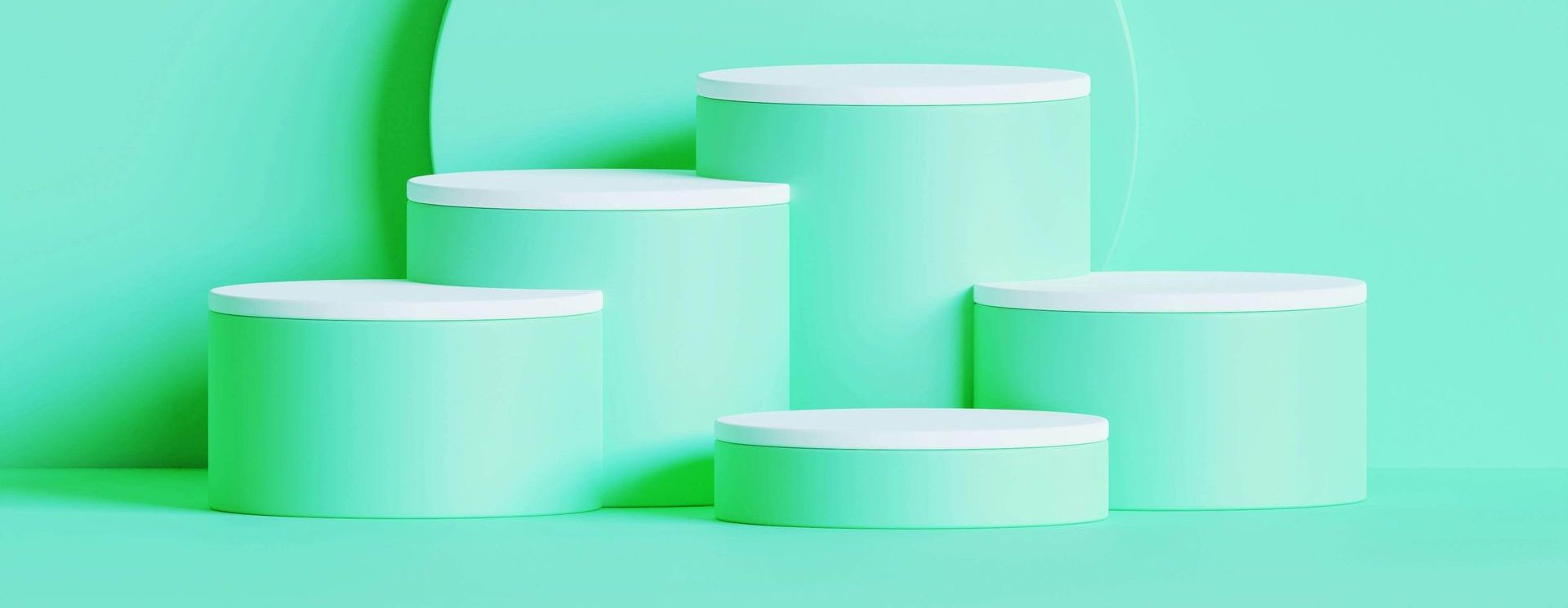 Five mint-colored cylindrical podiums with white tops against a mint background.
