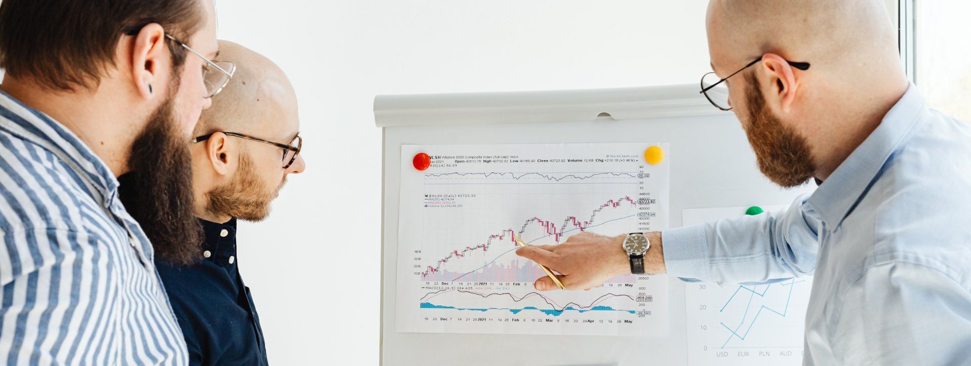 People checking out a trend report for the data hiring landscape