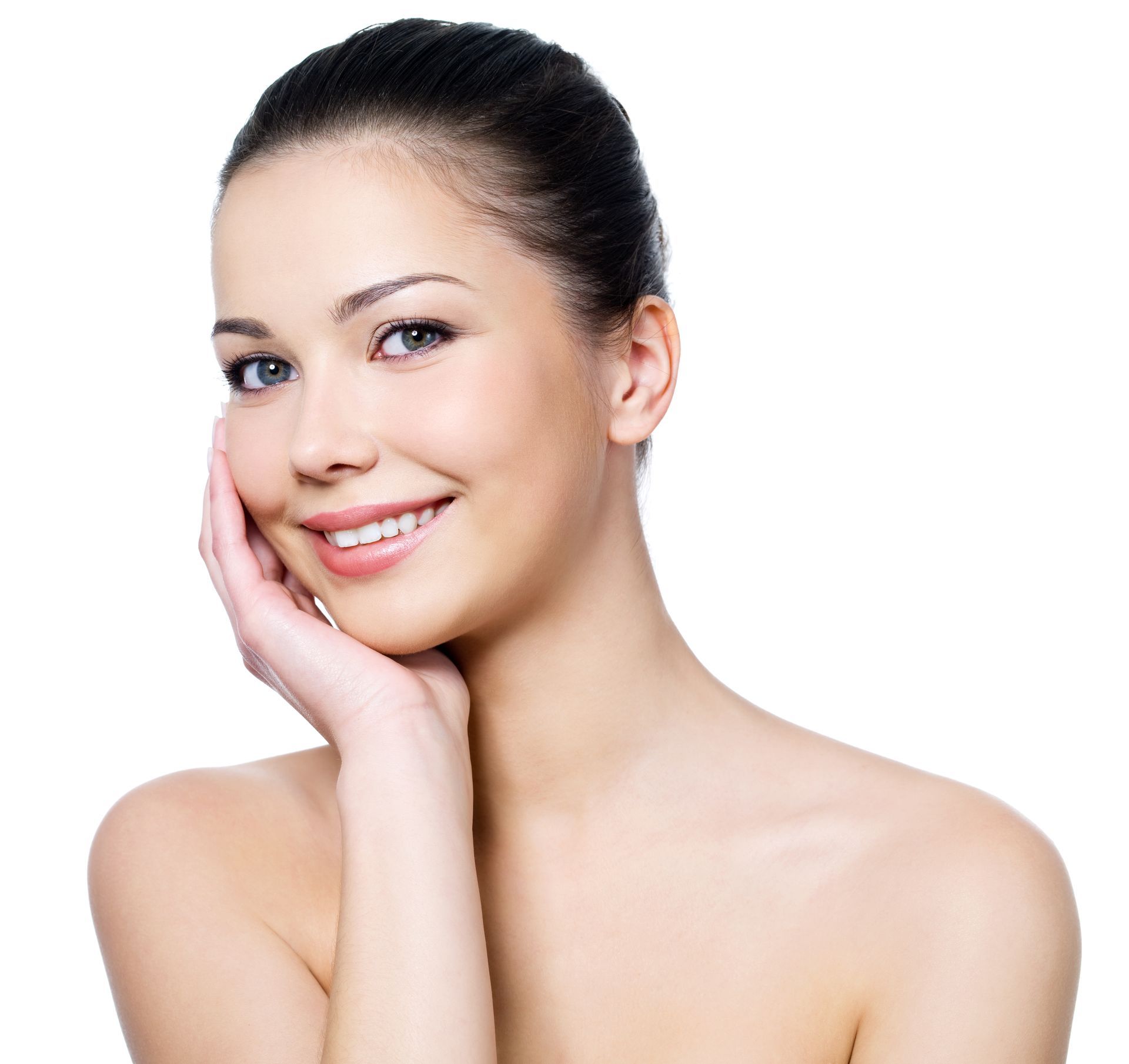 a woman is smiling and touching her face with her hand