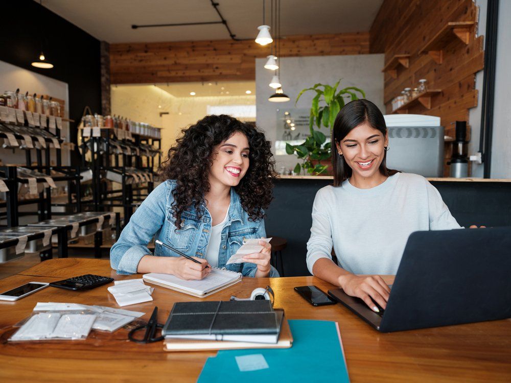 Two Women In Store Using Laptop — Okmulgee, OK — Greg Marriott CPA PLLC Two Women In Store Using Laptop — Okmulgee, OK — Greg Marriott CPA PLLC