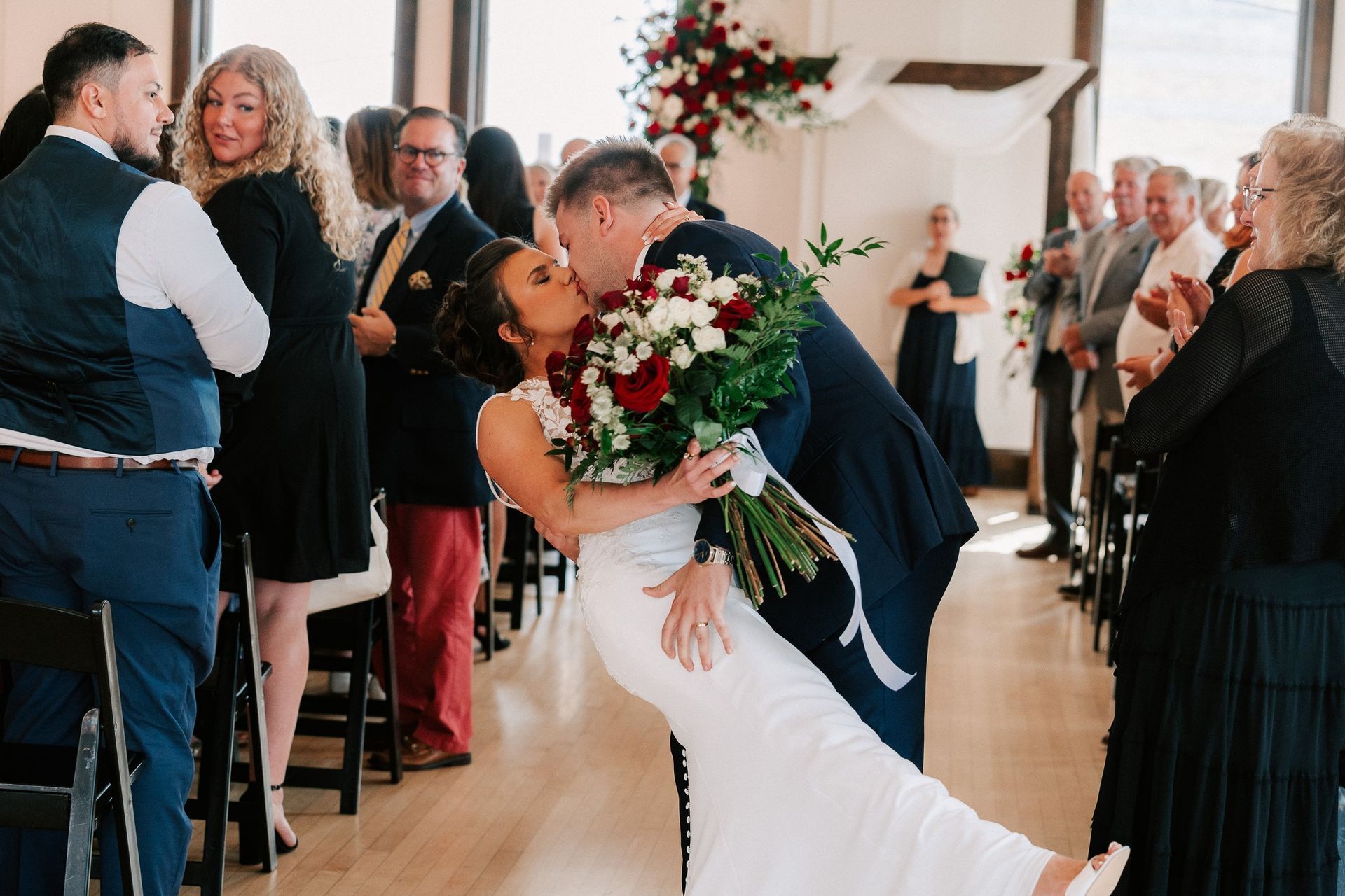 a wedding couple kissing at their wedding celebration at the Ballroom at the Reserve in Neenah Wisconsin