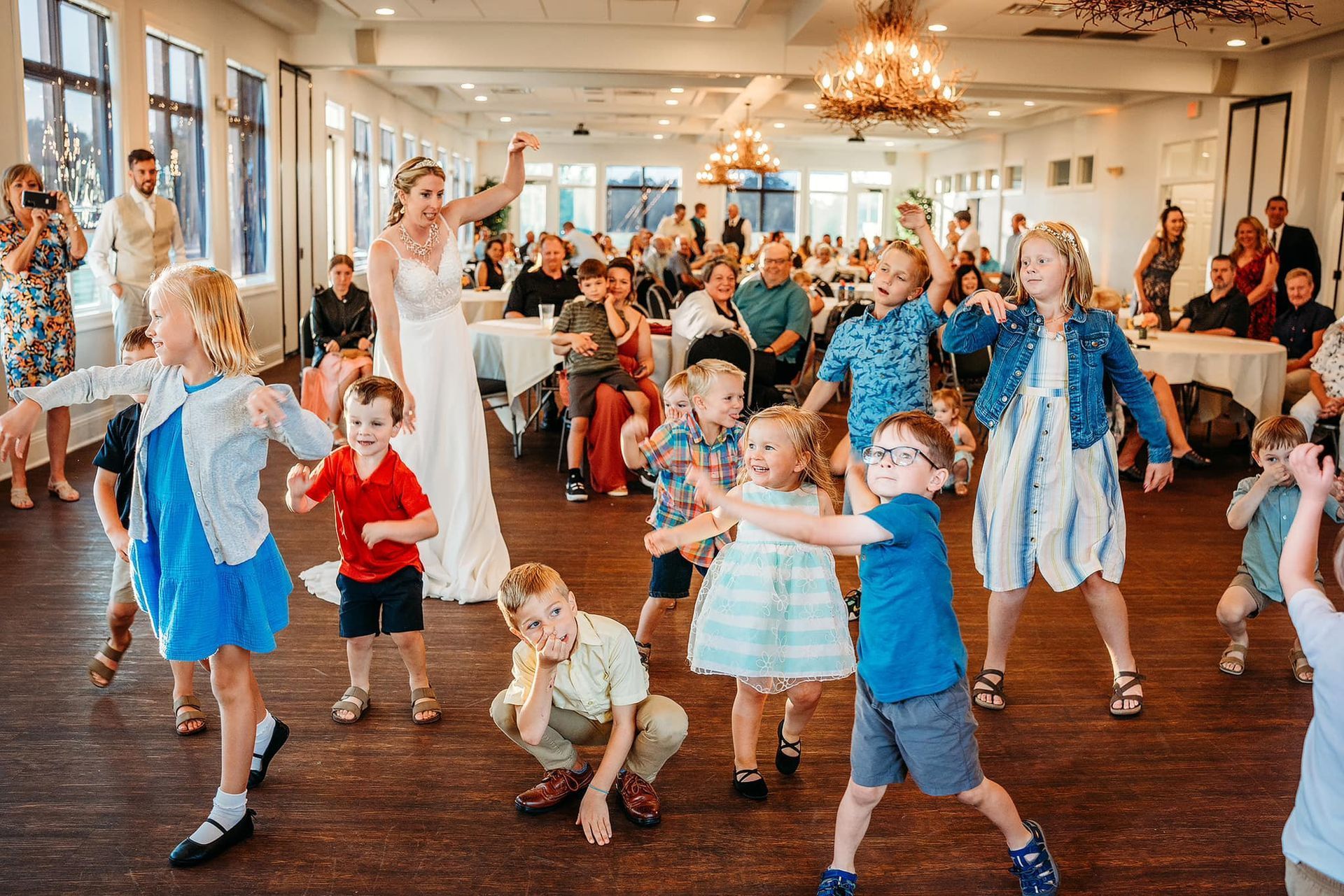 packed dance floor at a wedding reception at Whispering Springs Golf Club in Fond Du Lac
