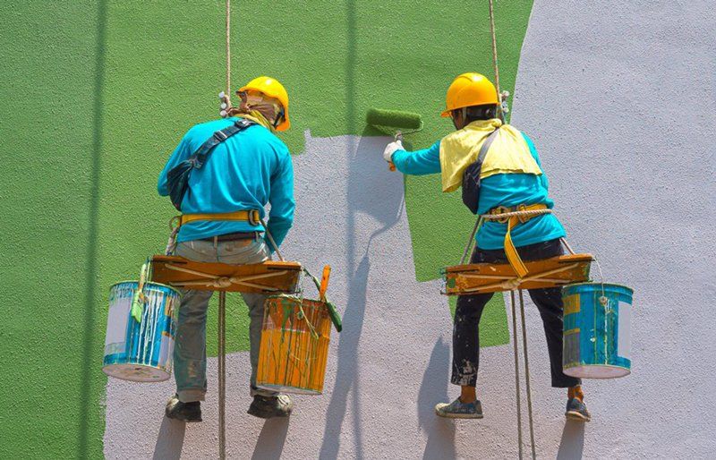 Painters Are Painting The Exterior Of The Building - Painting Services in North Mackay, QLD