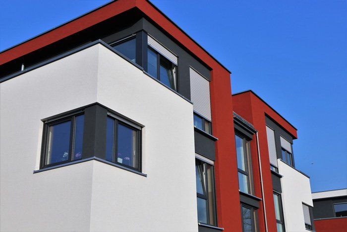 Newly Painted House With Red, Black And White Paint