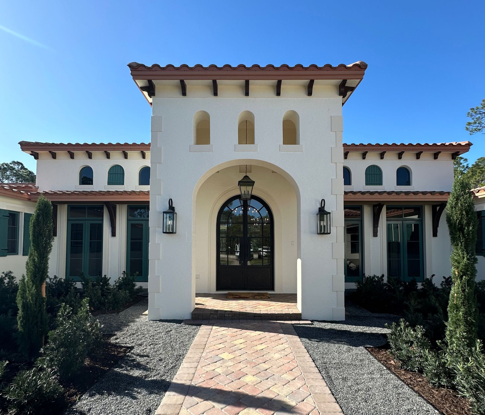 A luxurious home with impact front doors.