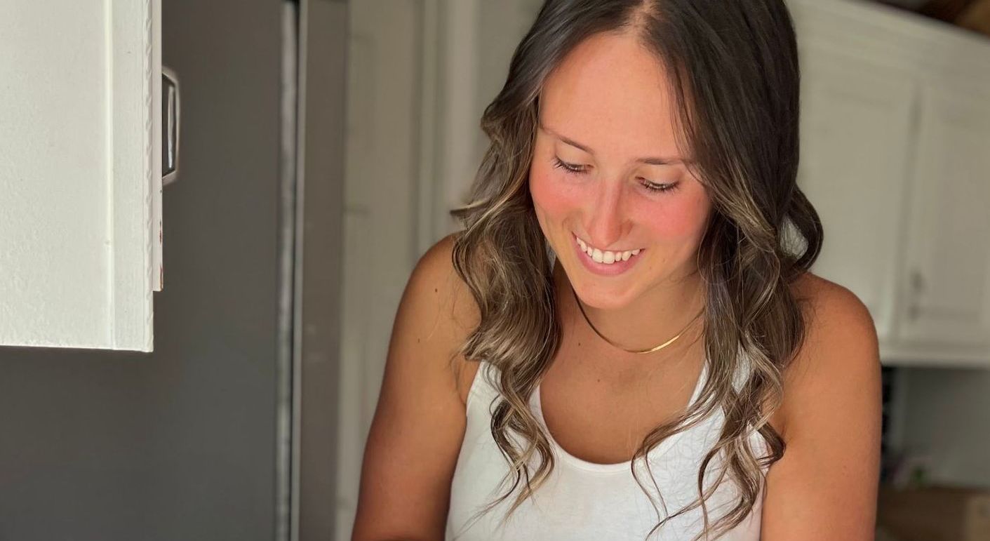 Jourdan prepares a healthy, wholesome snack in her client's bright kitchen.