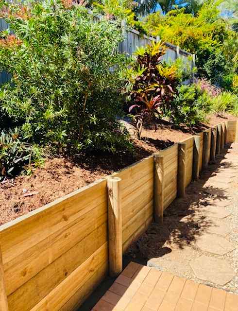 Garden Elevated with Wooden Retaining Wall — Trinity Landscape in Cairns, QLD