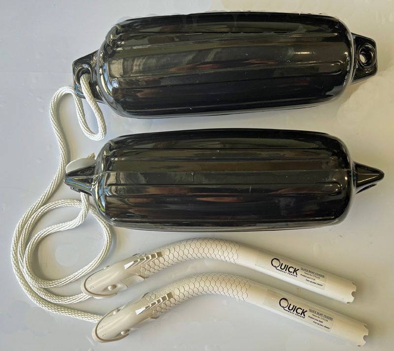 a pair of black fenders that say quick on them