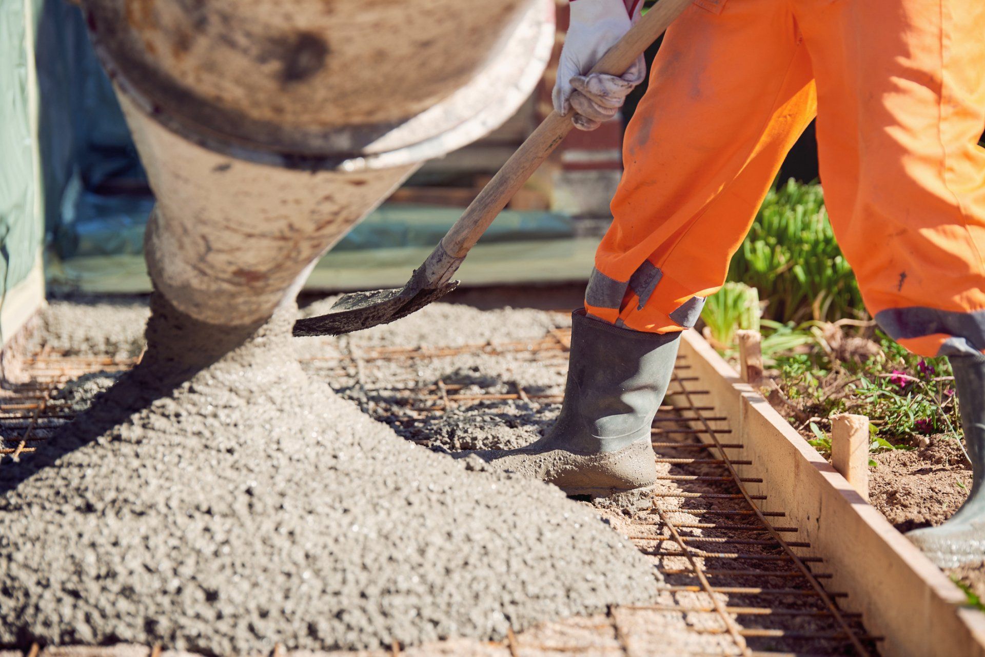 Worker Spreading Ready Mix Concrete — Fort Worth, TX — H & H Concrete On Demand