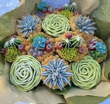 Assorted colorful succulent bouquet wrapped in green and light brown tissue paper