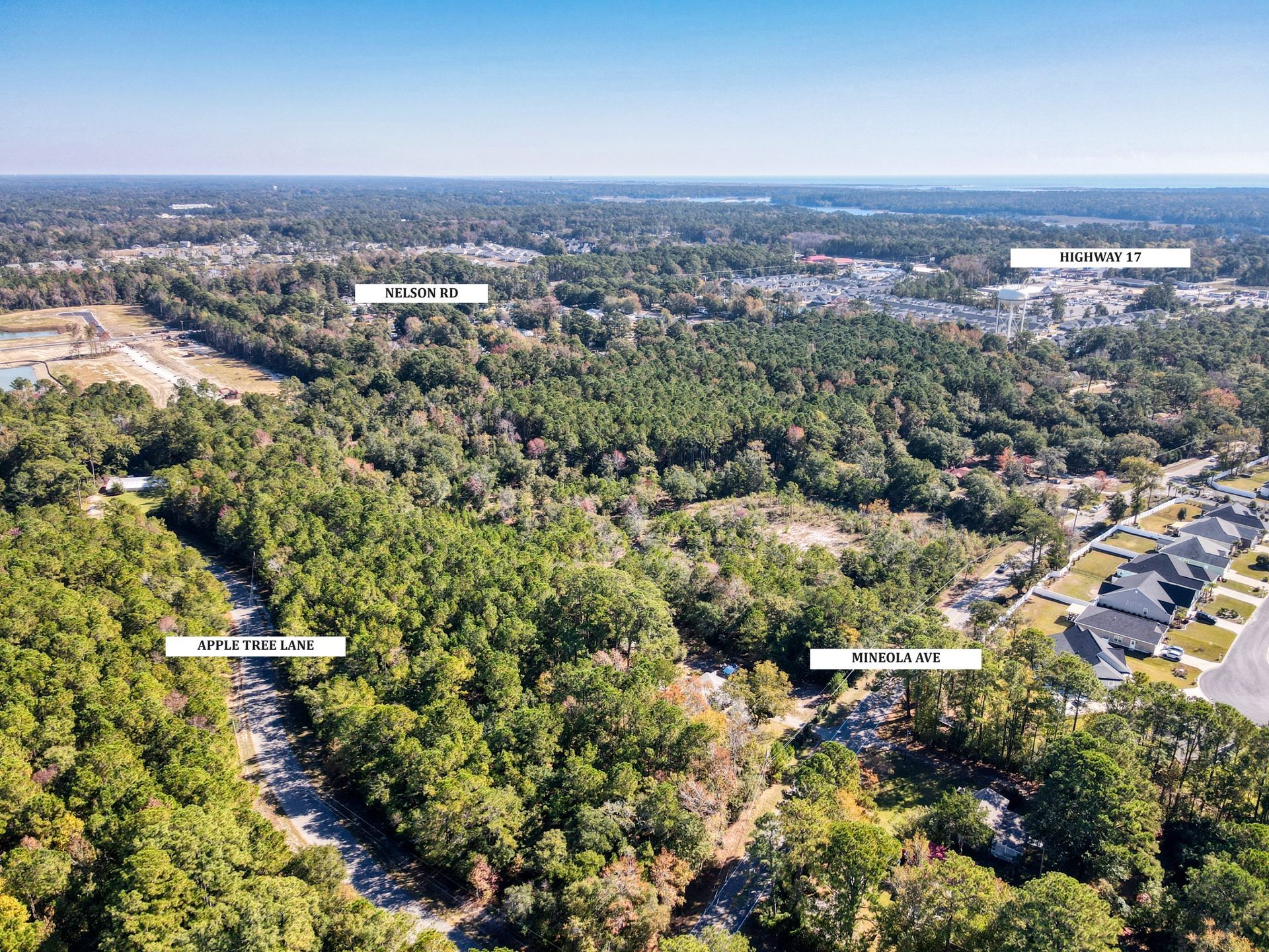 Aerial view of a wooded area with streets and some buildings labeled: Fairlawn, Millcreek, and 501.