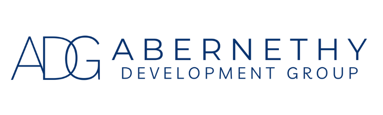 ADG Abernethy Development Group logo in navy blue.