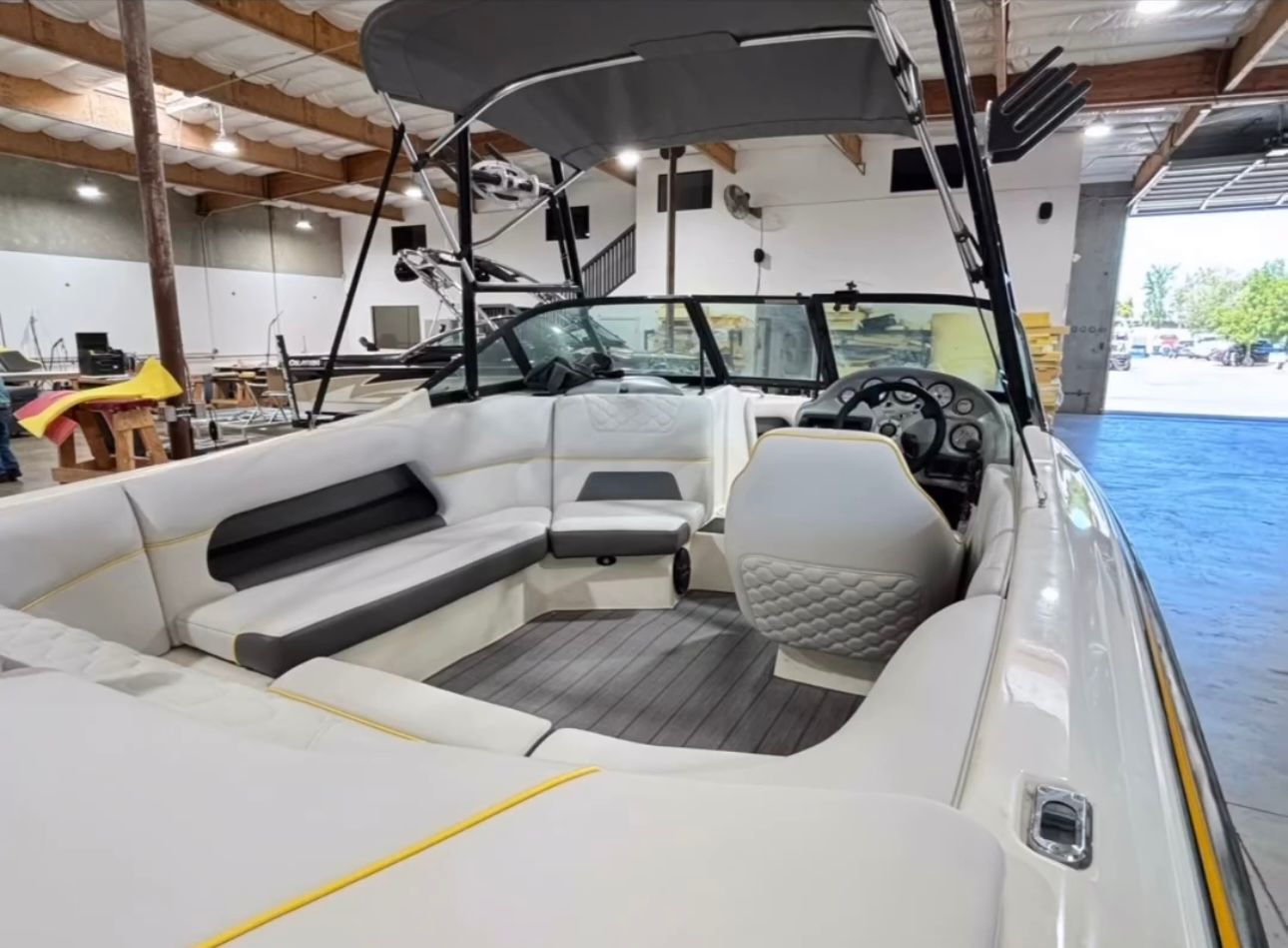 The inside of a boat is shown in a warehouse.
