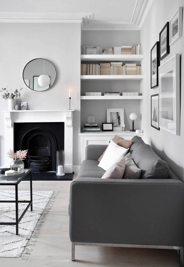 A Living Room with A Couch, Fireplace, Shelves, and A Mirror — Taree Paint Centre in Taree, NSW