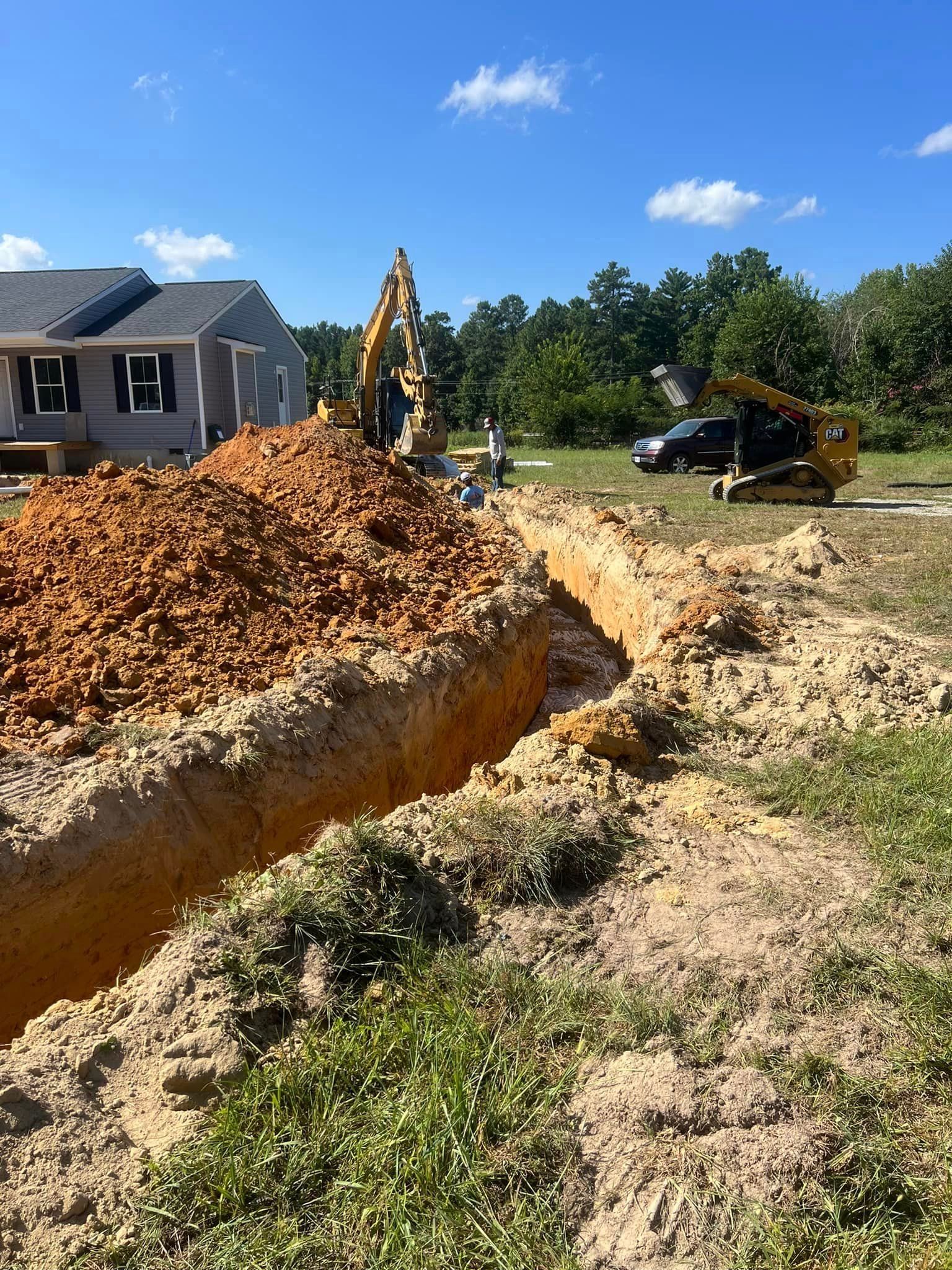 RVA Site Services with an excavator working on a septic tank installation in Richmond, VA