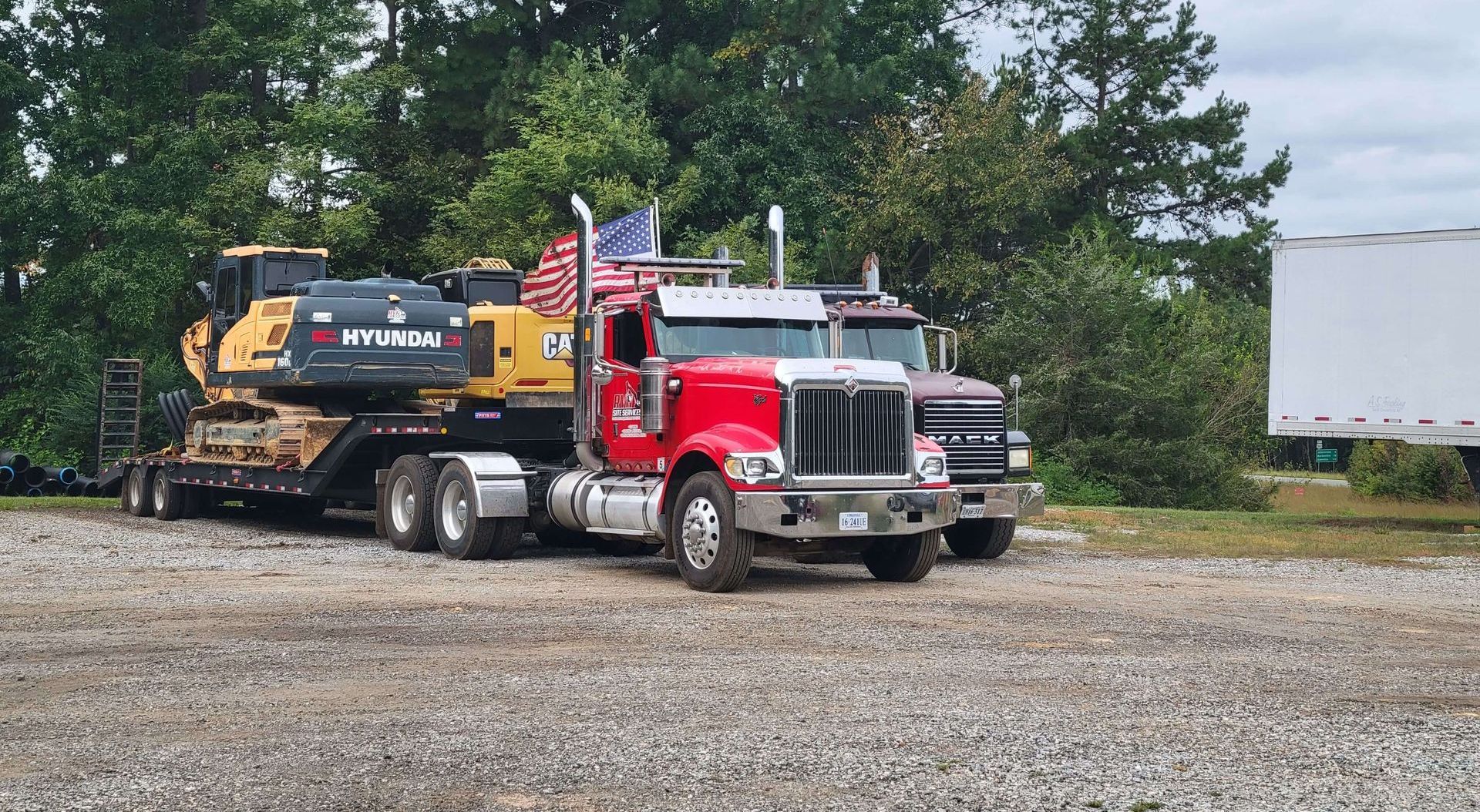 Hauling trucks parked at a construction site.