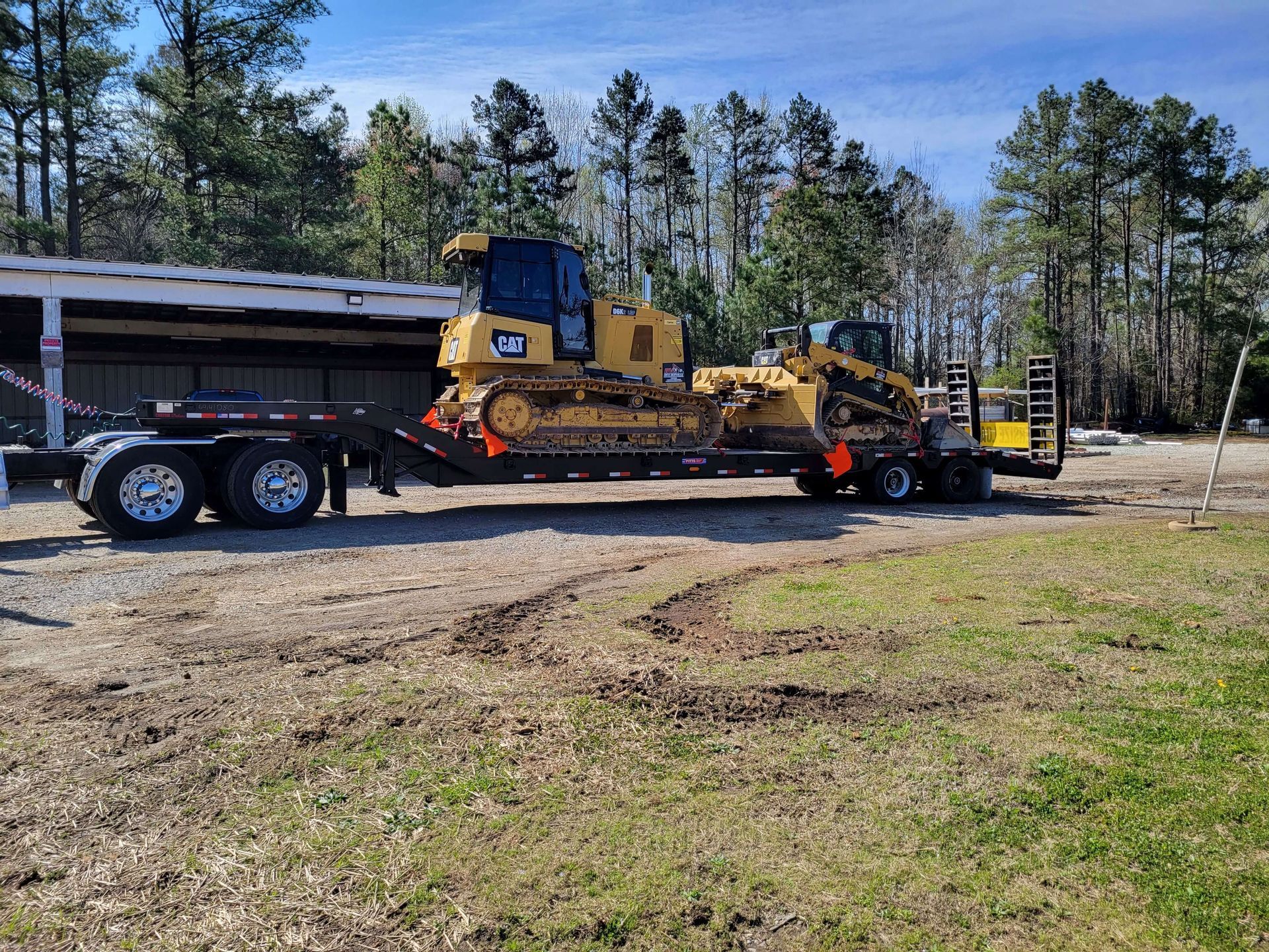RVA Site Services arriving to a construction site with heavy land clearing equipment