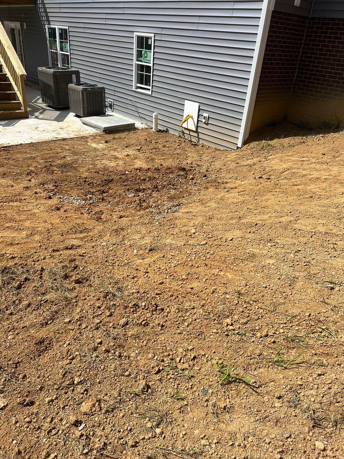 Slope grading to improve surface water movement across residential property